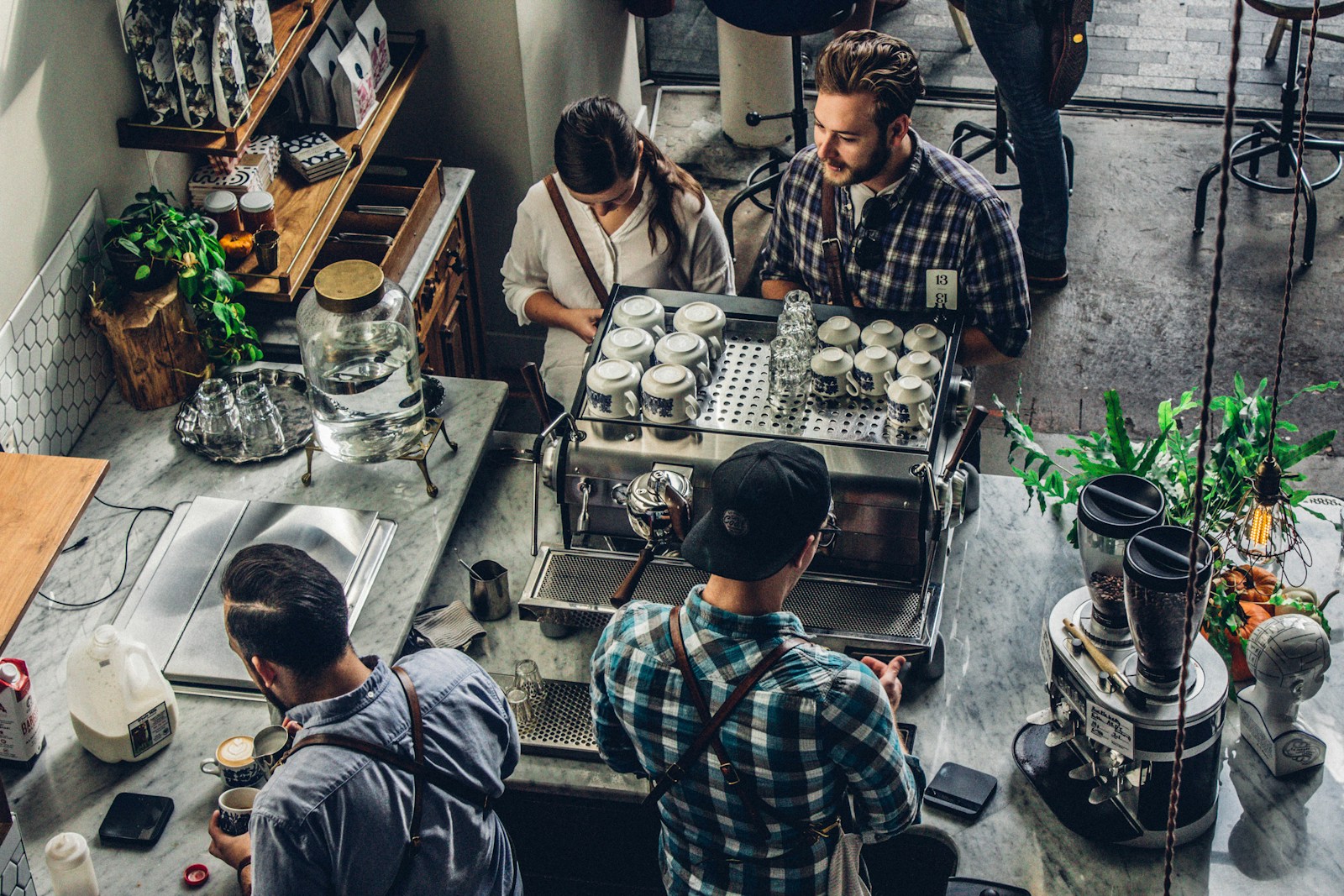A busy local cafe team working together